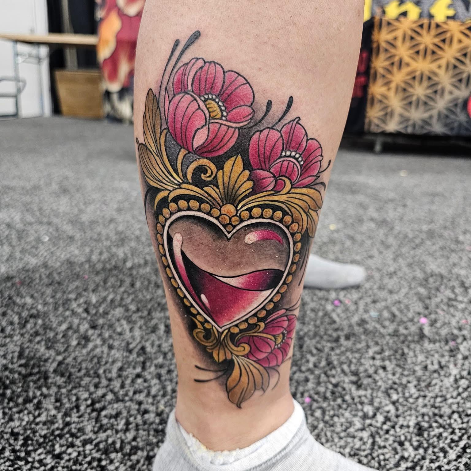 Heart with floral crown American traditional tattoo on the calf by jersey ink tattoos, Elizabeth, New Jersey