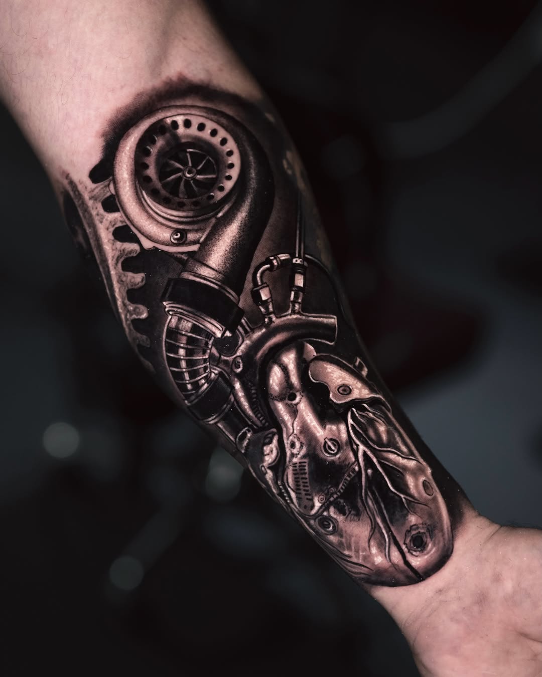 Mechanical heart and turbocharger biomech tattoo on the forearm by Marcos Salamanca