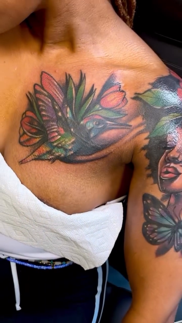 Hummingbird and flowers chest piece watercolor tattoo on the shoulder by Inkby_larry