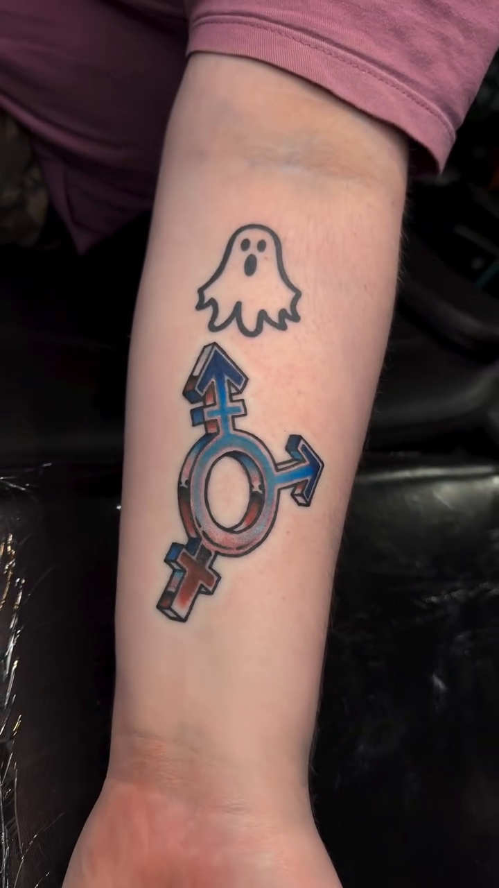 Ghost and transgender symbol new school tattoo on the forearm by Mercy Dean