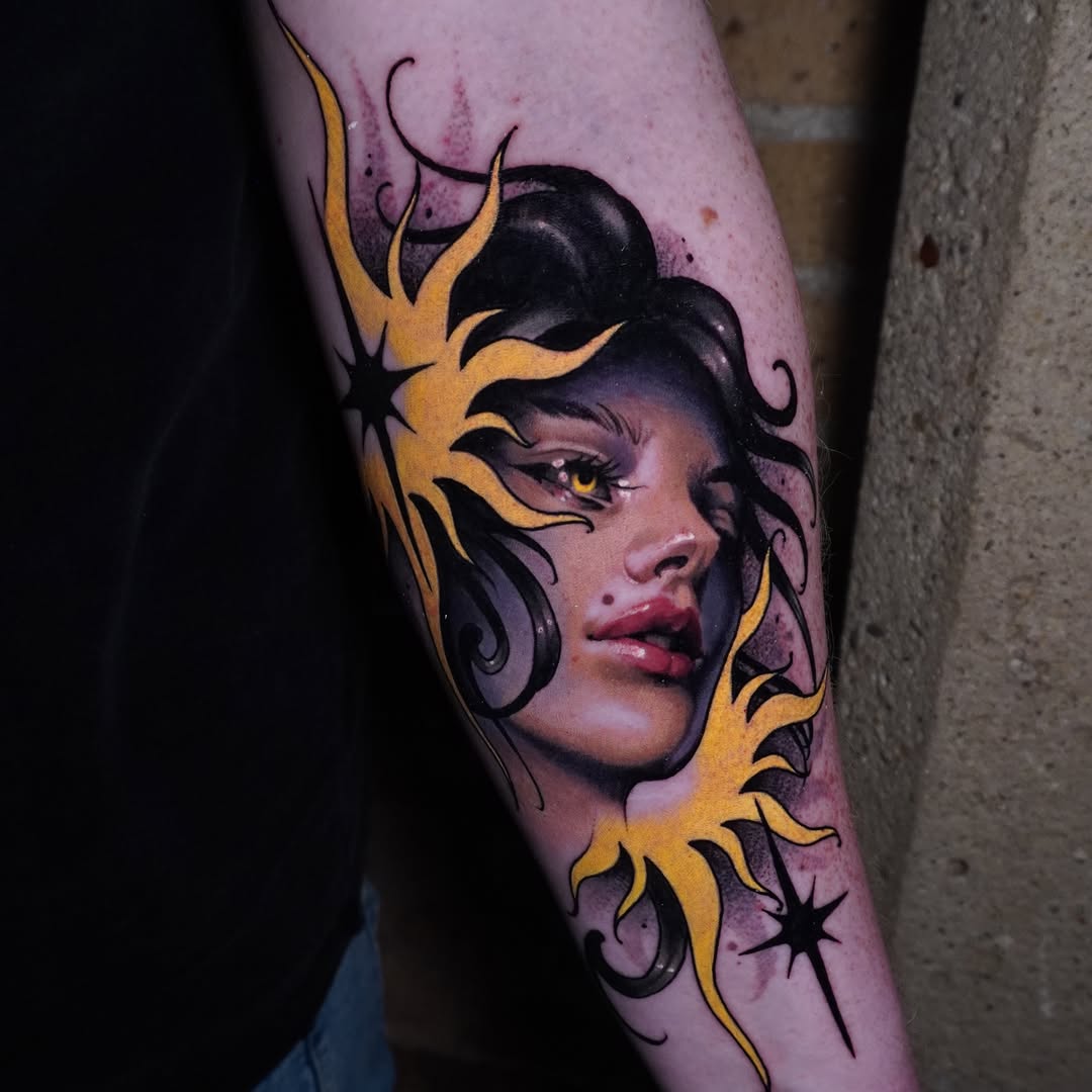 Woman's face with sun rays neo-traditional tattoo on the forearm by Andrey