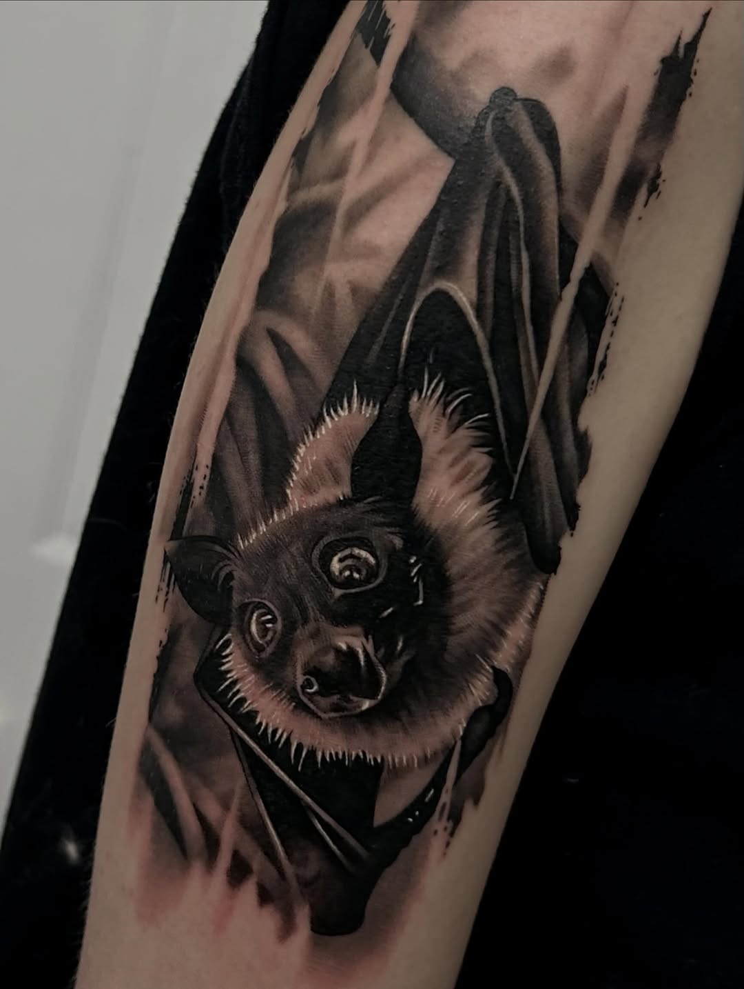 Bat dark art tattoo on the forearm by Dallas Corsmeier