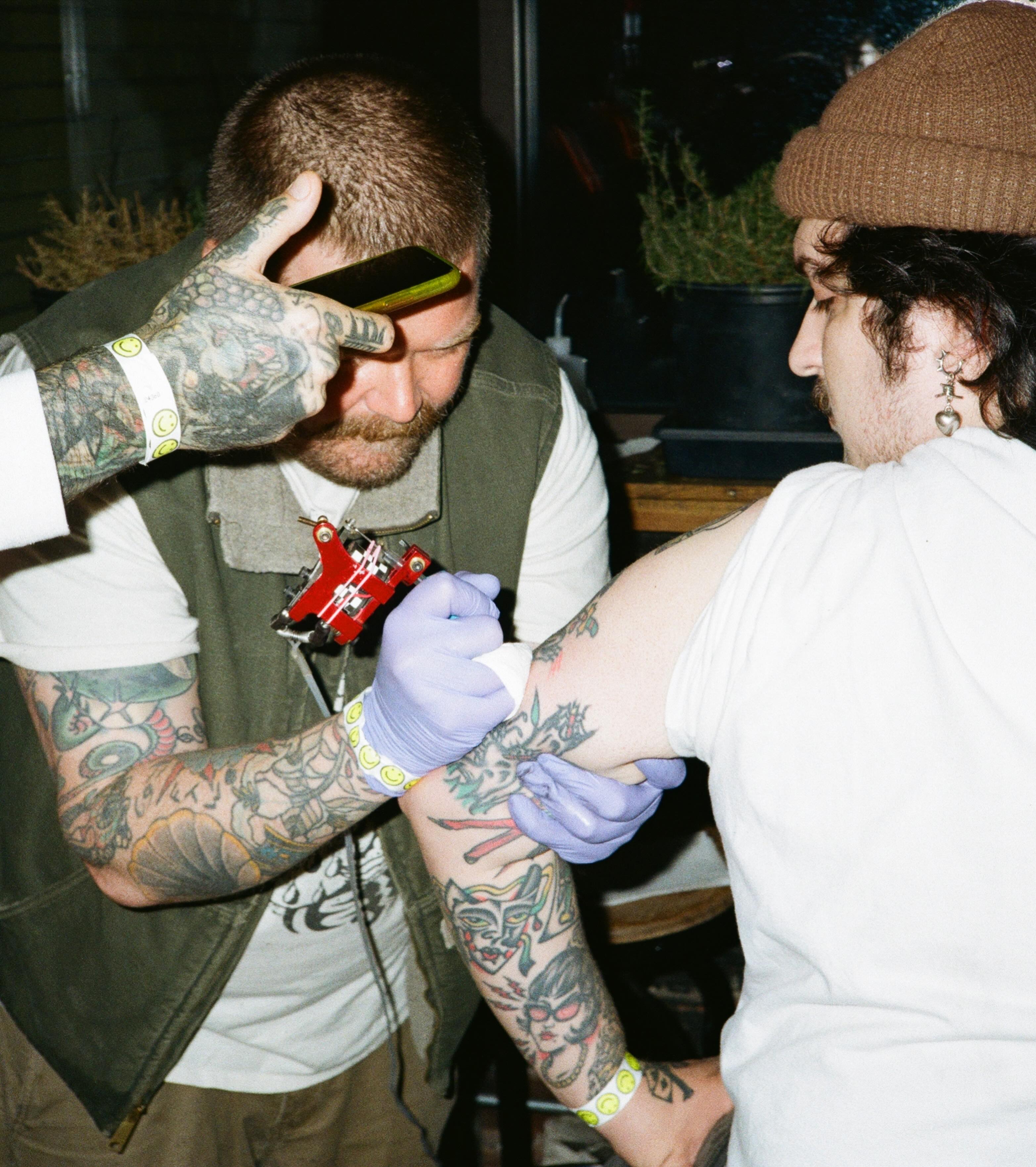 Face American traditional tattoo on the forearm by Steve Reid
