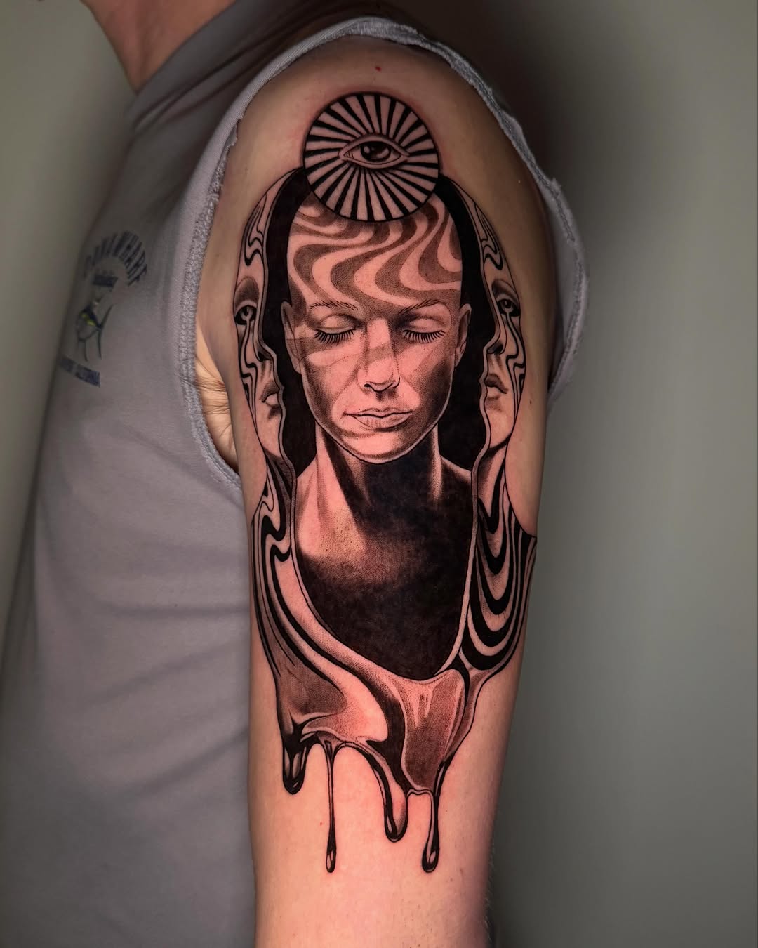 Surreal portrait with melting effect surrealism tattoo on the forearm by Erin Blaney