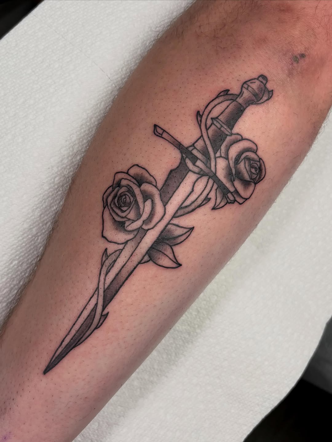 Dagger and roses American traditional tattoo on the forearm by ππ‘ππ―π² πππ₯π₯ππ²