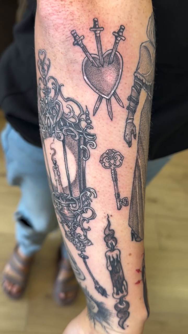 Lanterns, keys, and hearts with swords sketch tattoo on the forearm by Stvn Geyer, Urbandale, Iowa
