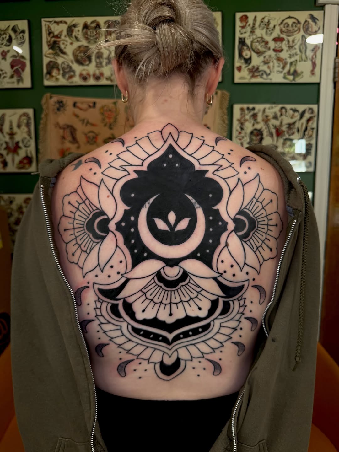Mandala with moon and floral elements geometric tattoo on the back by Dustie Pitstick