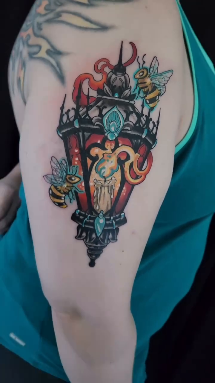 Lantern with bees American traditional tattoo on the upper arm by Randy