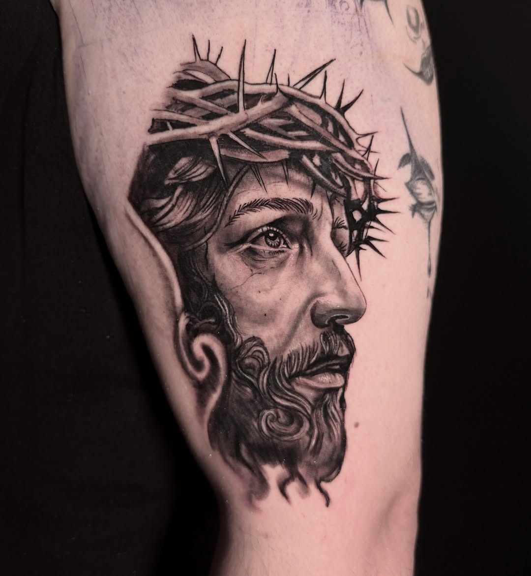 Jesus Christ portrait realism tattoo on the forearm by Alex Cantor