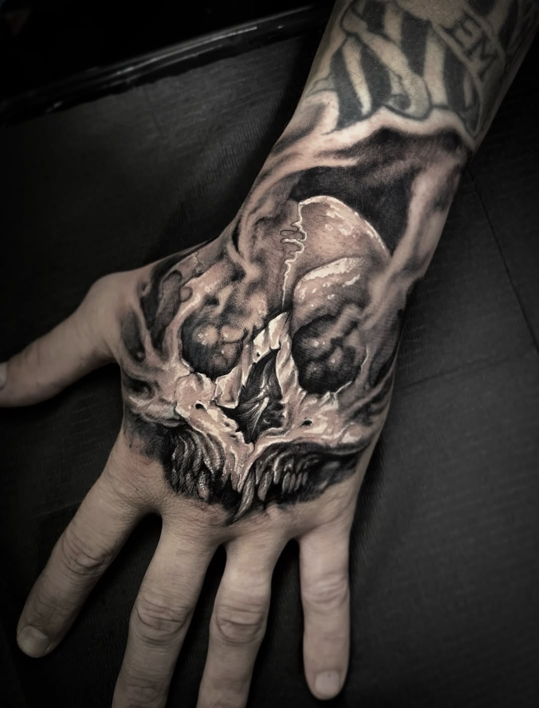 Skull with smoke realism tattoo on the hand by Xavi Xiva TATTOO