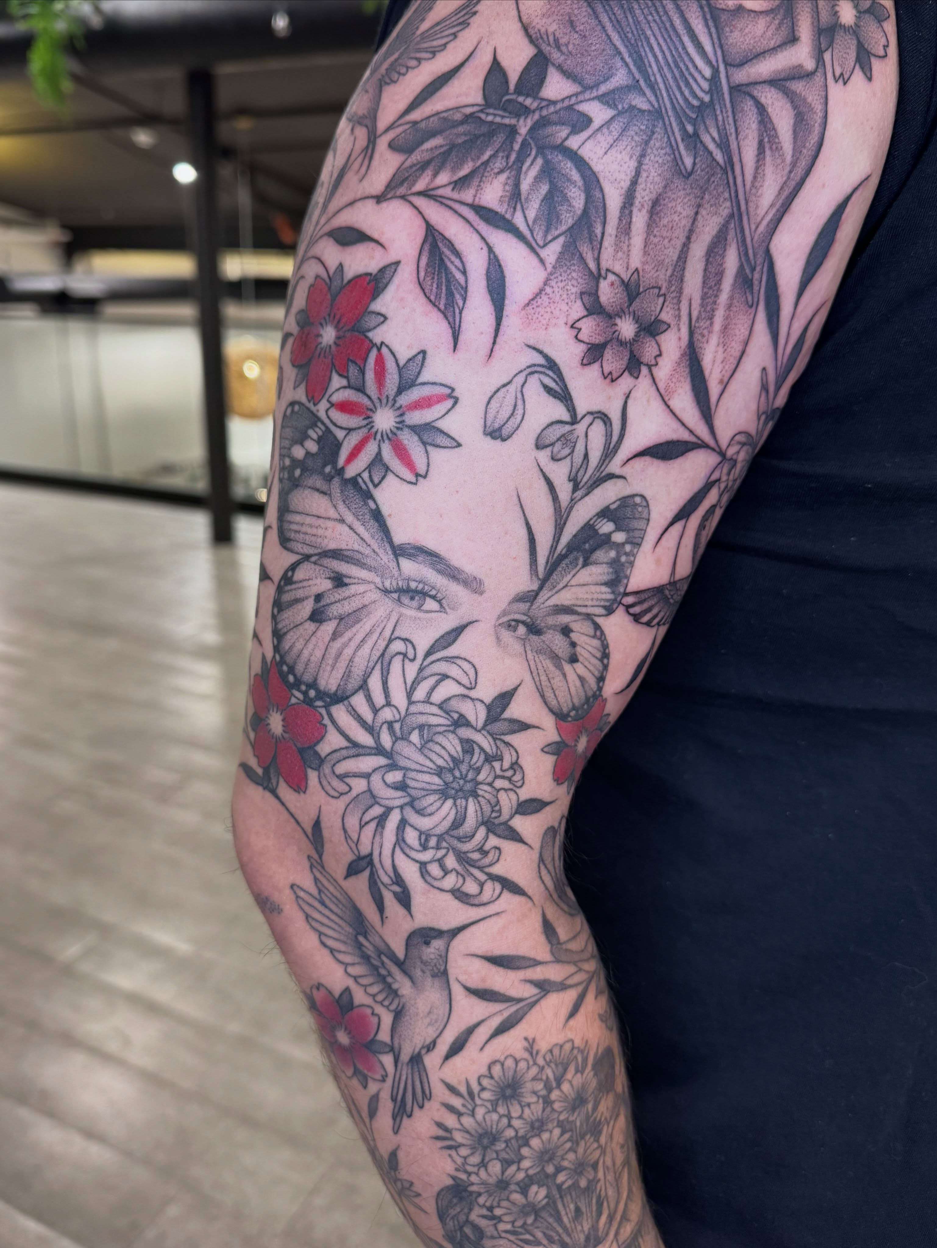 Floral and butterfly black and grey tattoo on the forearm by Tara Crespi - Female Tattoo Artist 💜