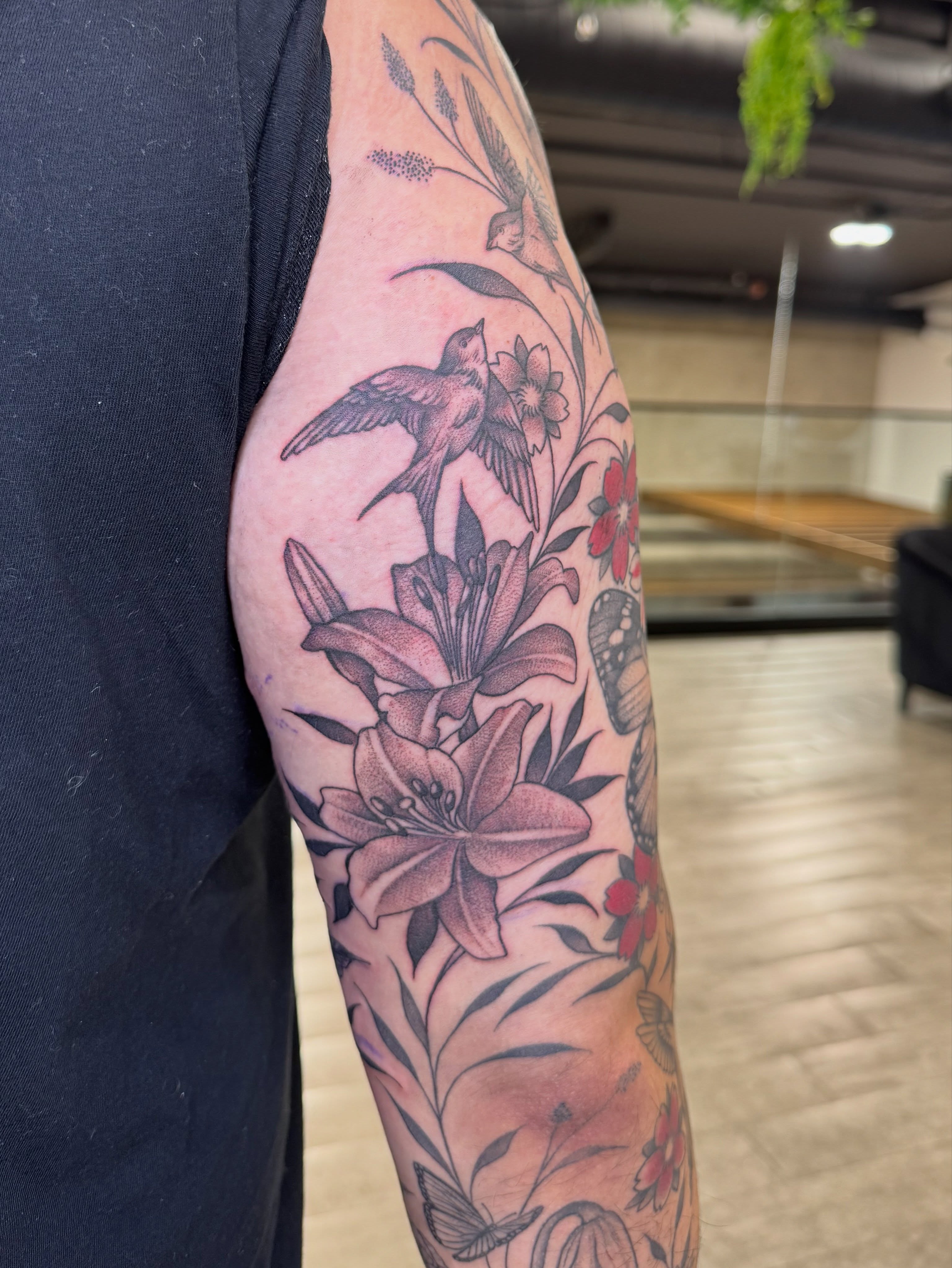 Lilies and birds American traditional tattoo on the forearm by Tara Crespi - Female Tattoo Artist 💜