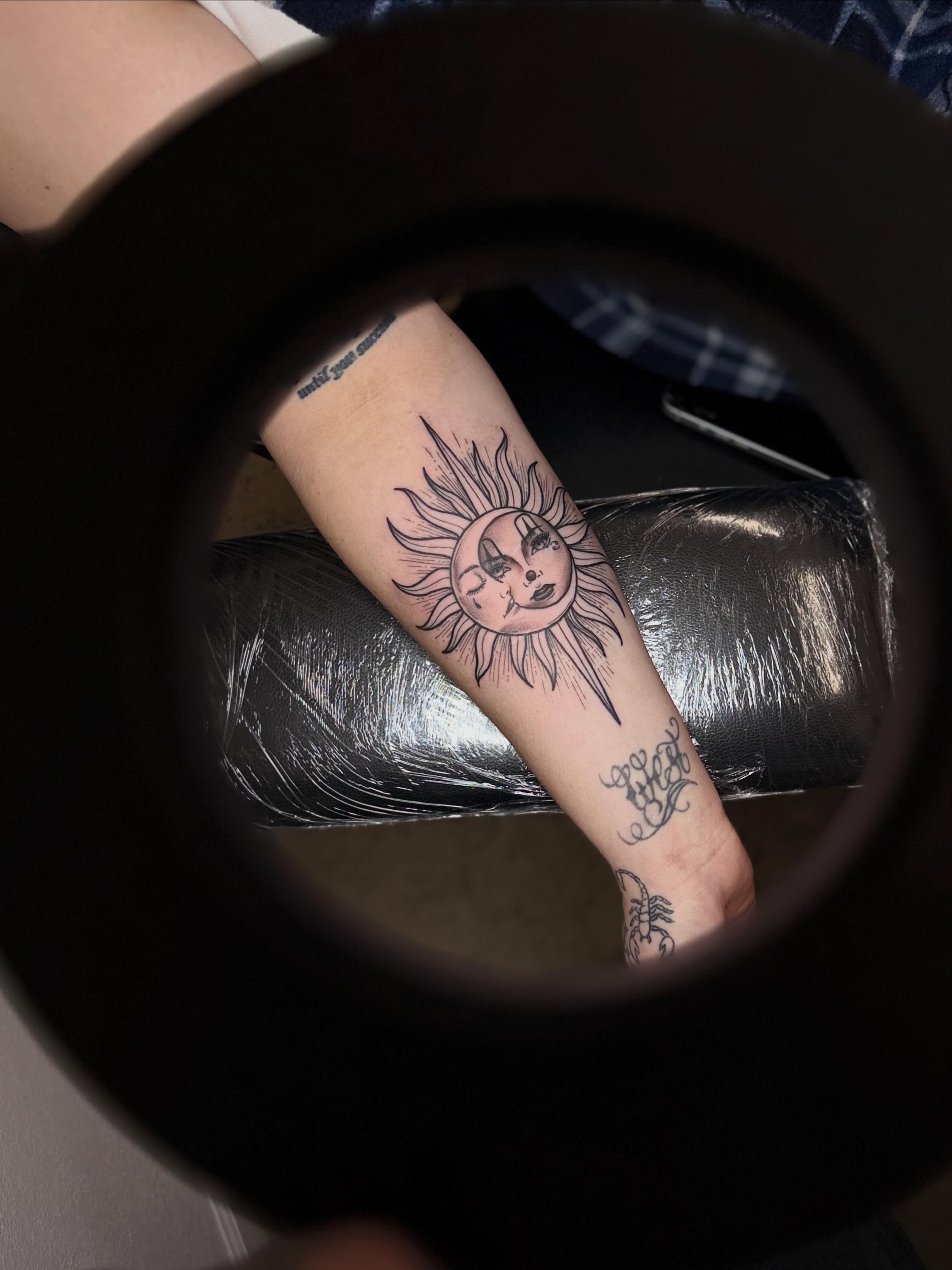 Sun neo-traditional tattoo on the forearm by H.G