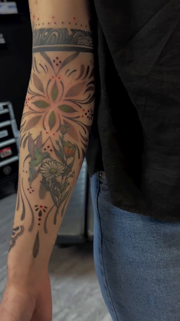Ornamental tattoo on the forearm by Raciel Fabian Romero