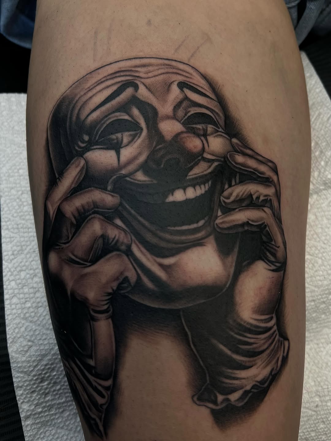 Clown face realism tattoo on the forearm by Hugo Ruiz-Esparza