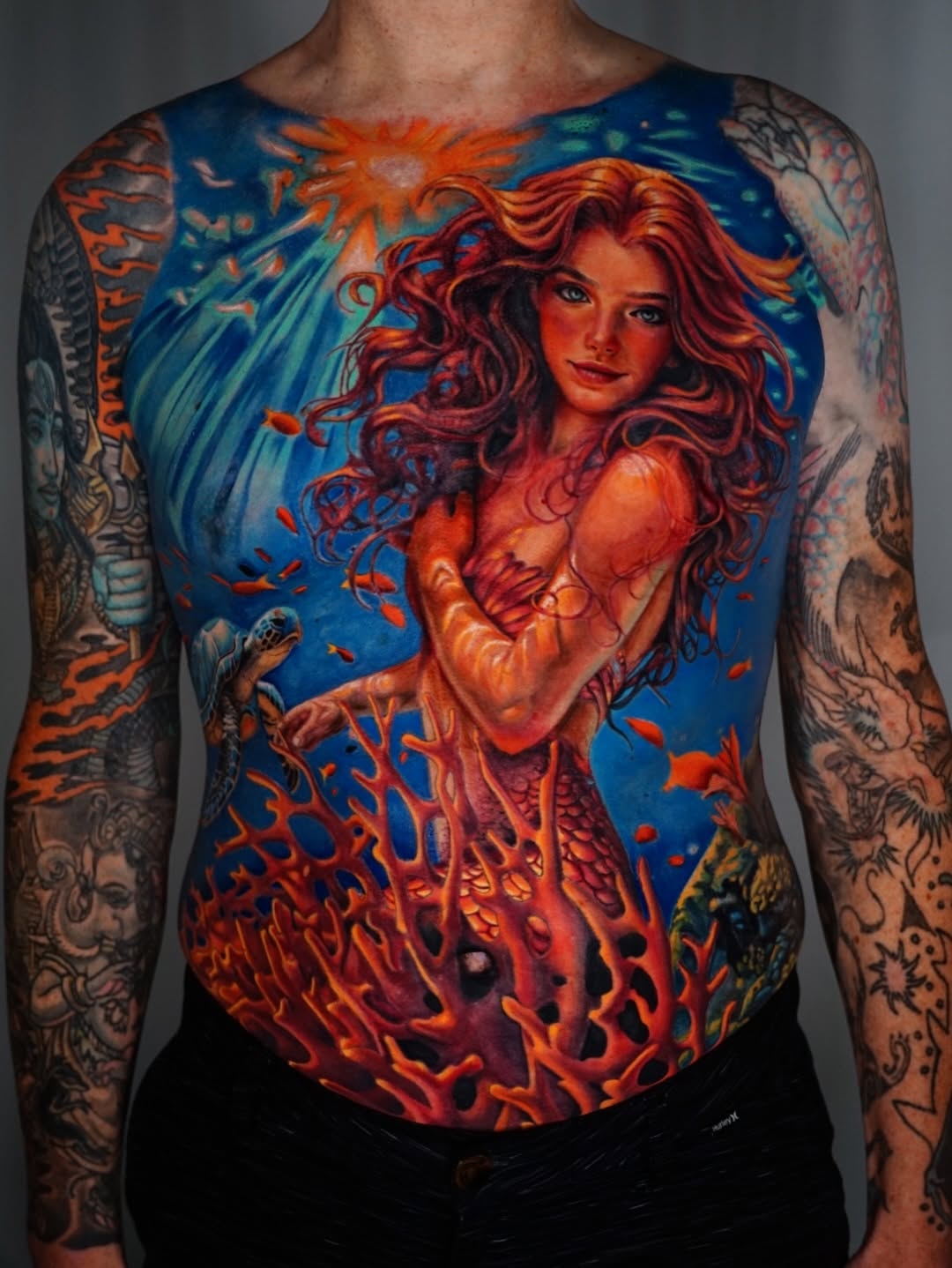 Mermaid and underwater scene surrealism tattoo on the torso by Nate