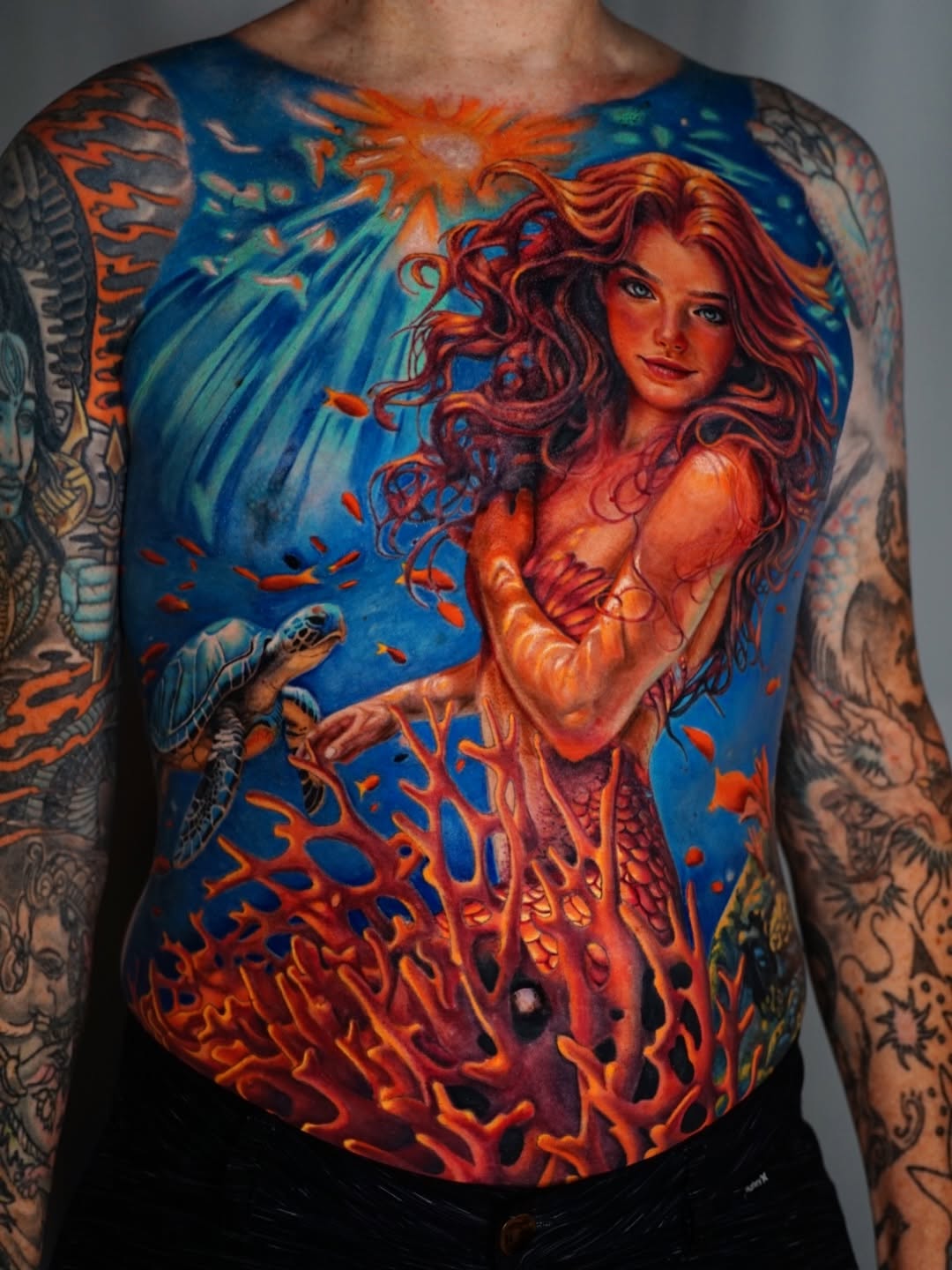 Mermaid and sea turtle surrealism tattoo on the torso by Nate