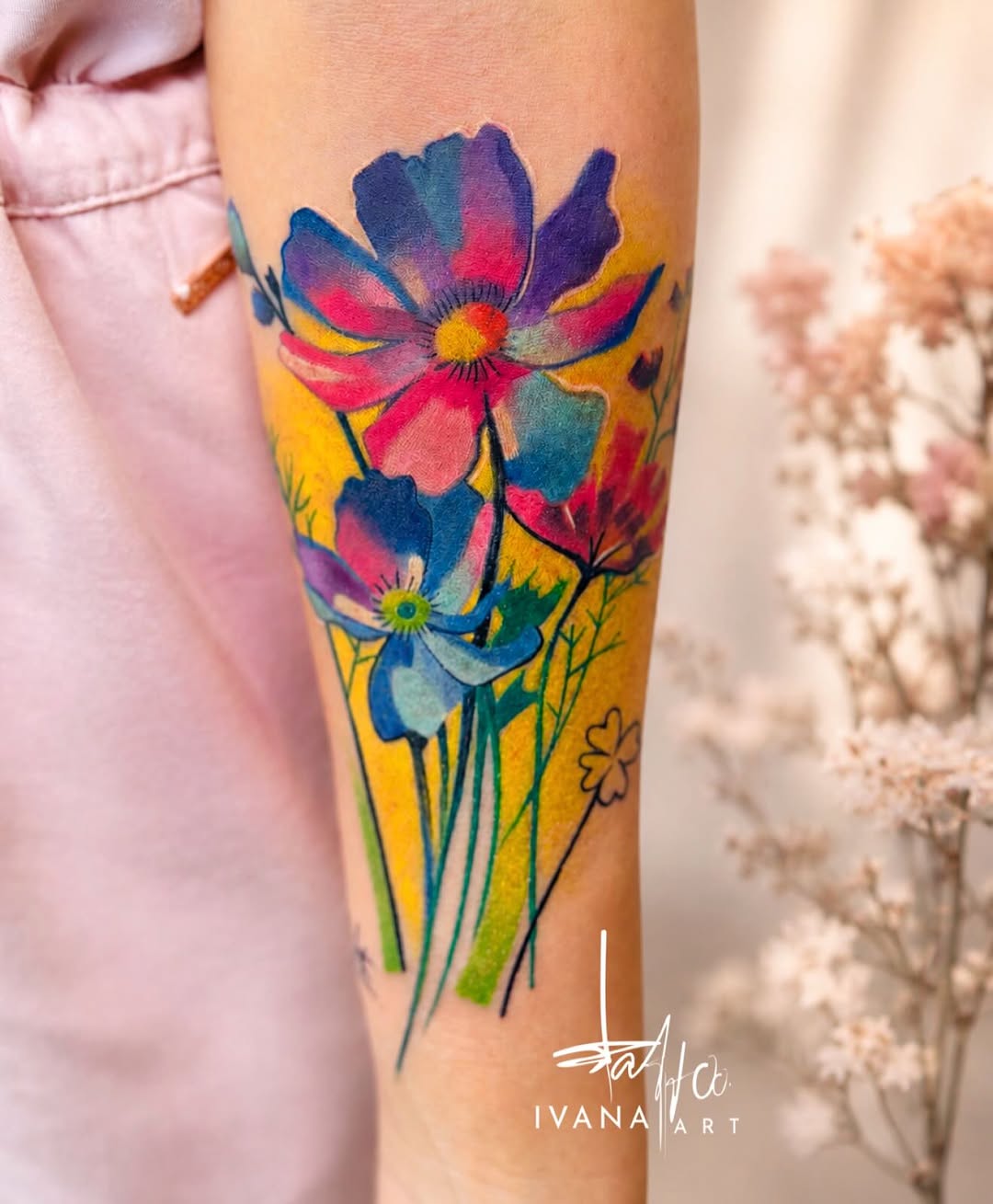 Flowers watercolor tattoo on the forearm by Ivana Belakova