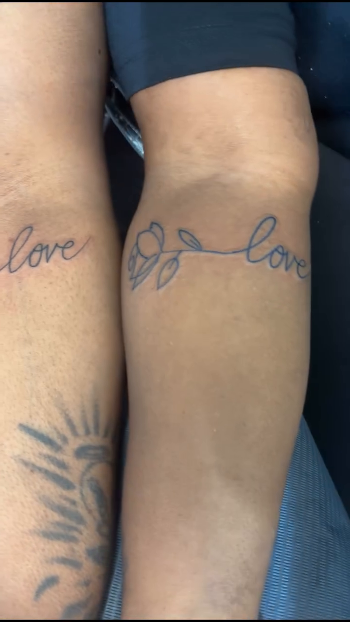 Rose and the word 'love' lettering tattoo on the forearm by Syneca Wilson, Acton, Massachusetts