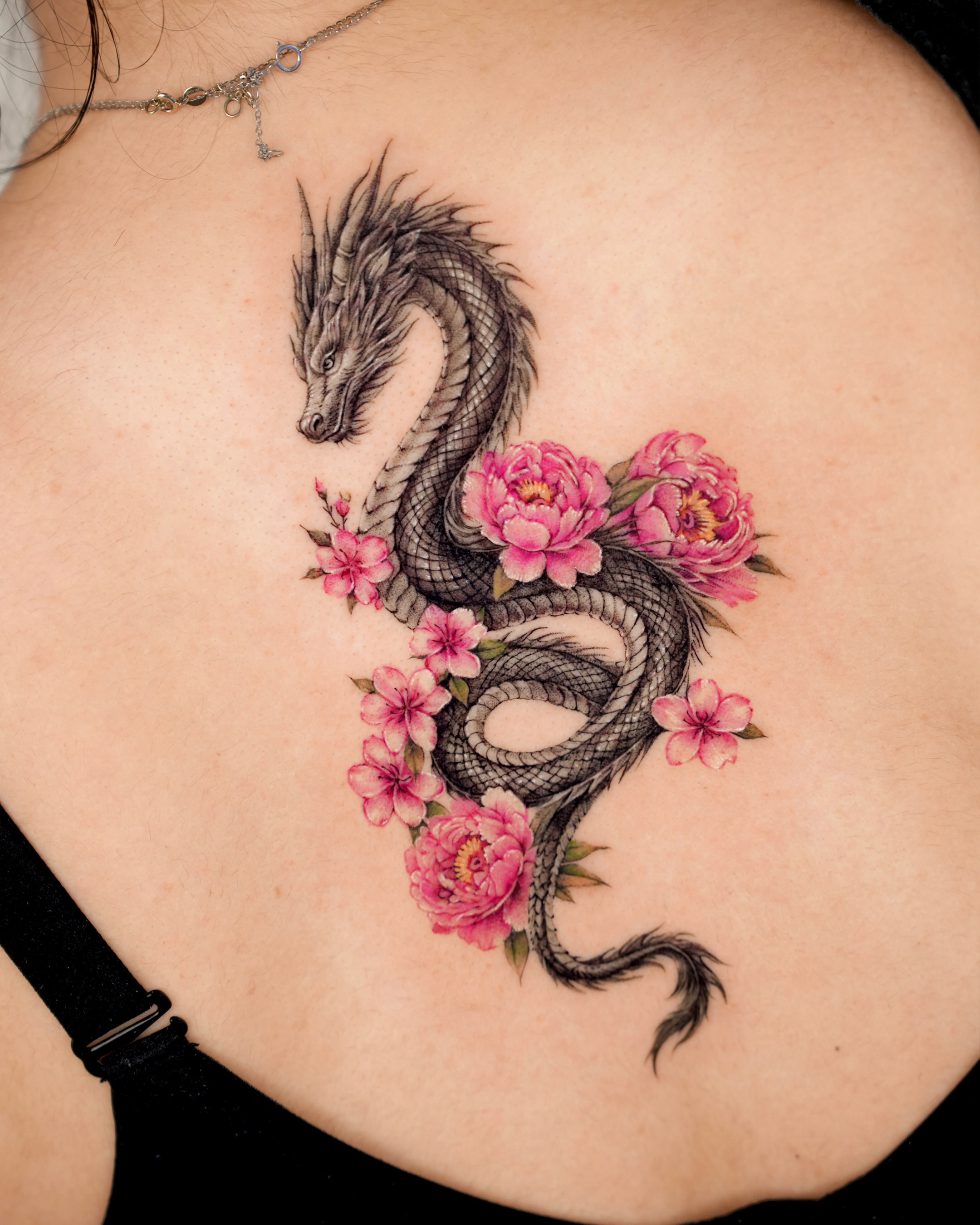 Dragon and flowers realism tattoo on the back by YUN