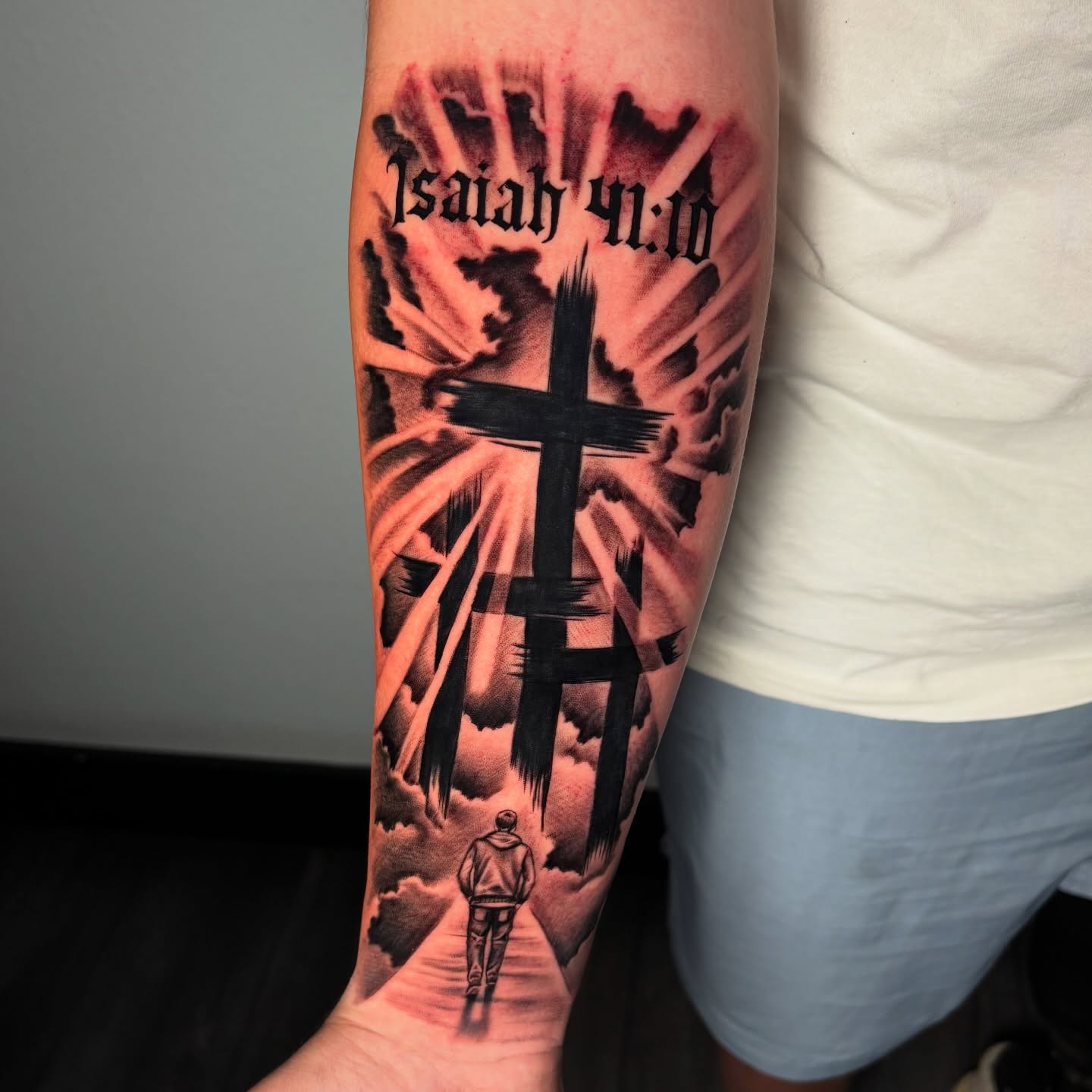 Cross and Isaiah 41:10 realism tattoo on the forearm by Dave