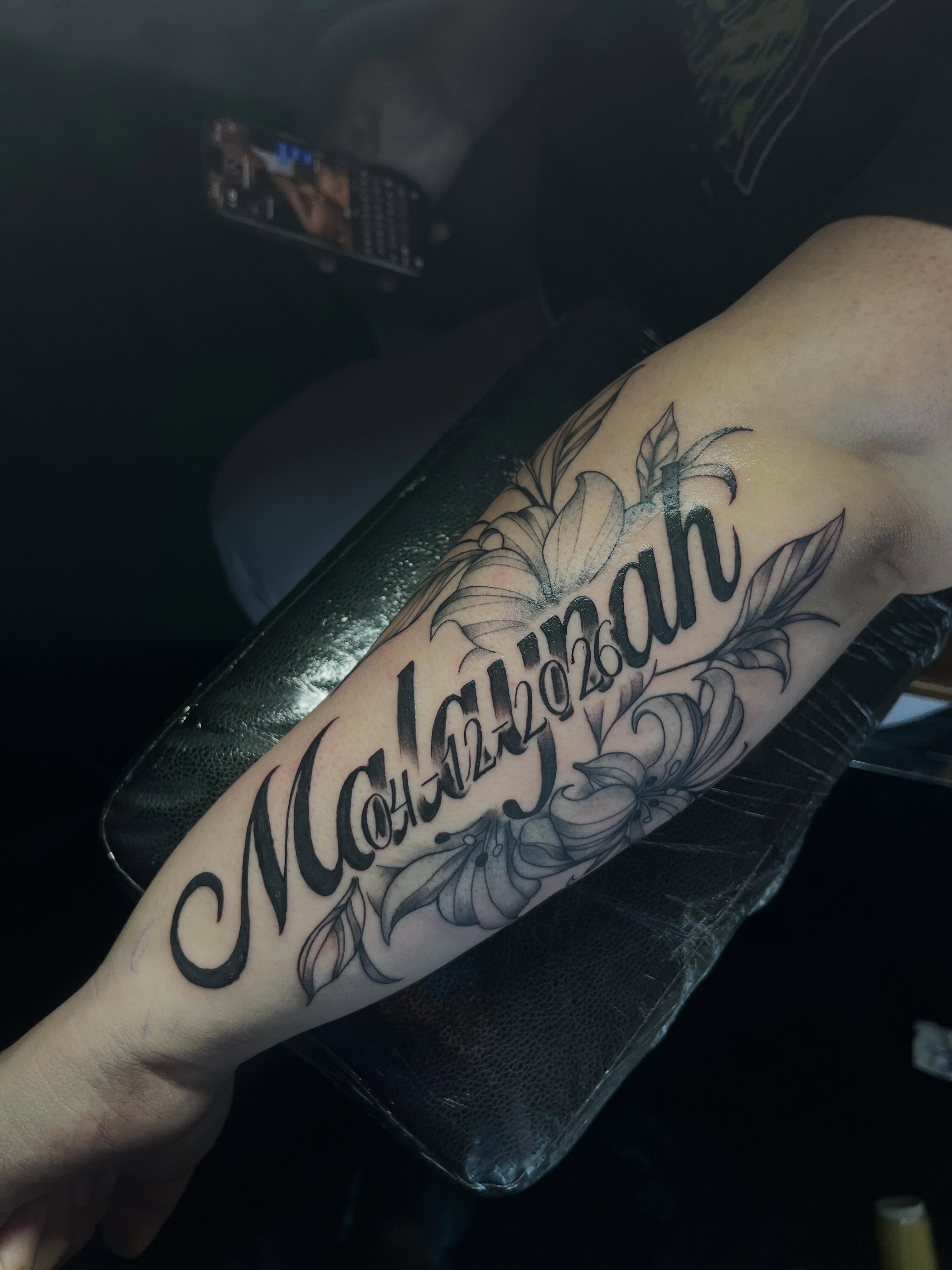 Malawiah black and grey tattoo on the forearm by Tam💟👩🏽‍🎨