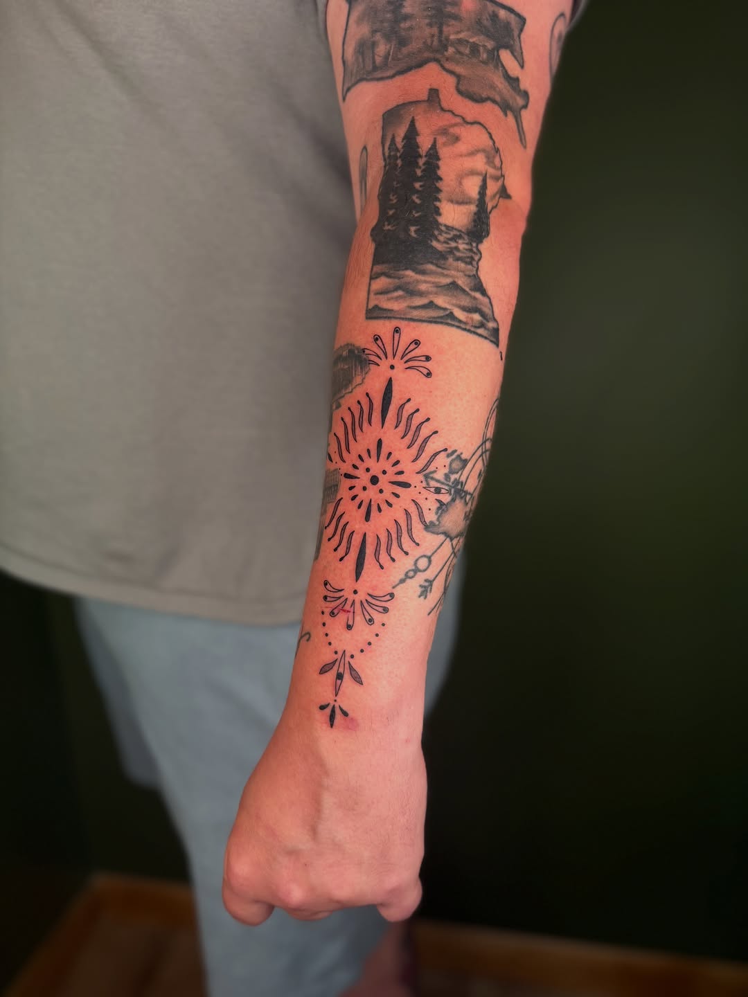 Ornamental sunburst and landscape ornamental tattoo on the forearm by ๐ฅ ๐๐ฅ๐๐ฑ๐ข๐ฌ ๐ฅ