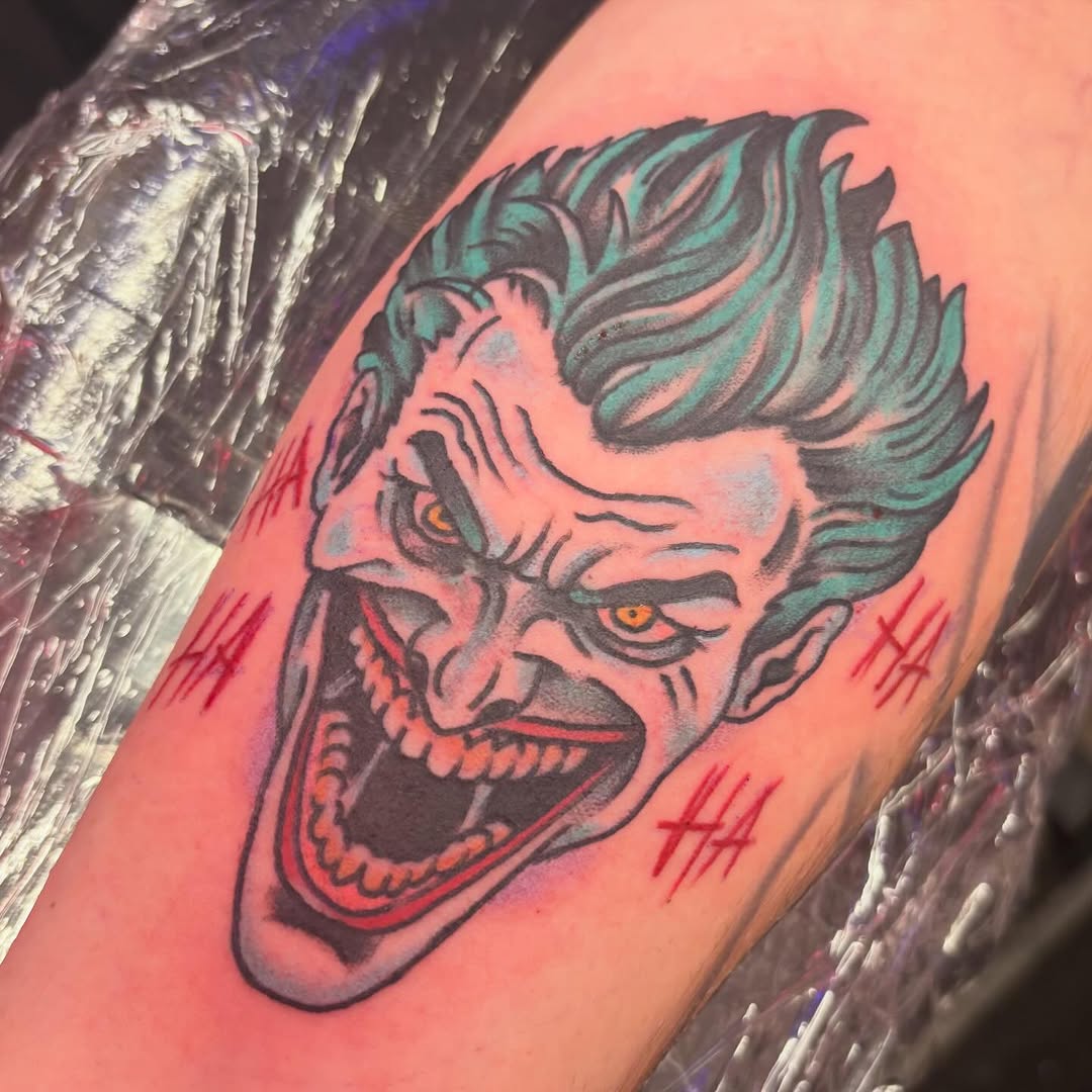The Joker face realism tattoo on the forearm by @dannydoestattoos