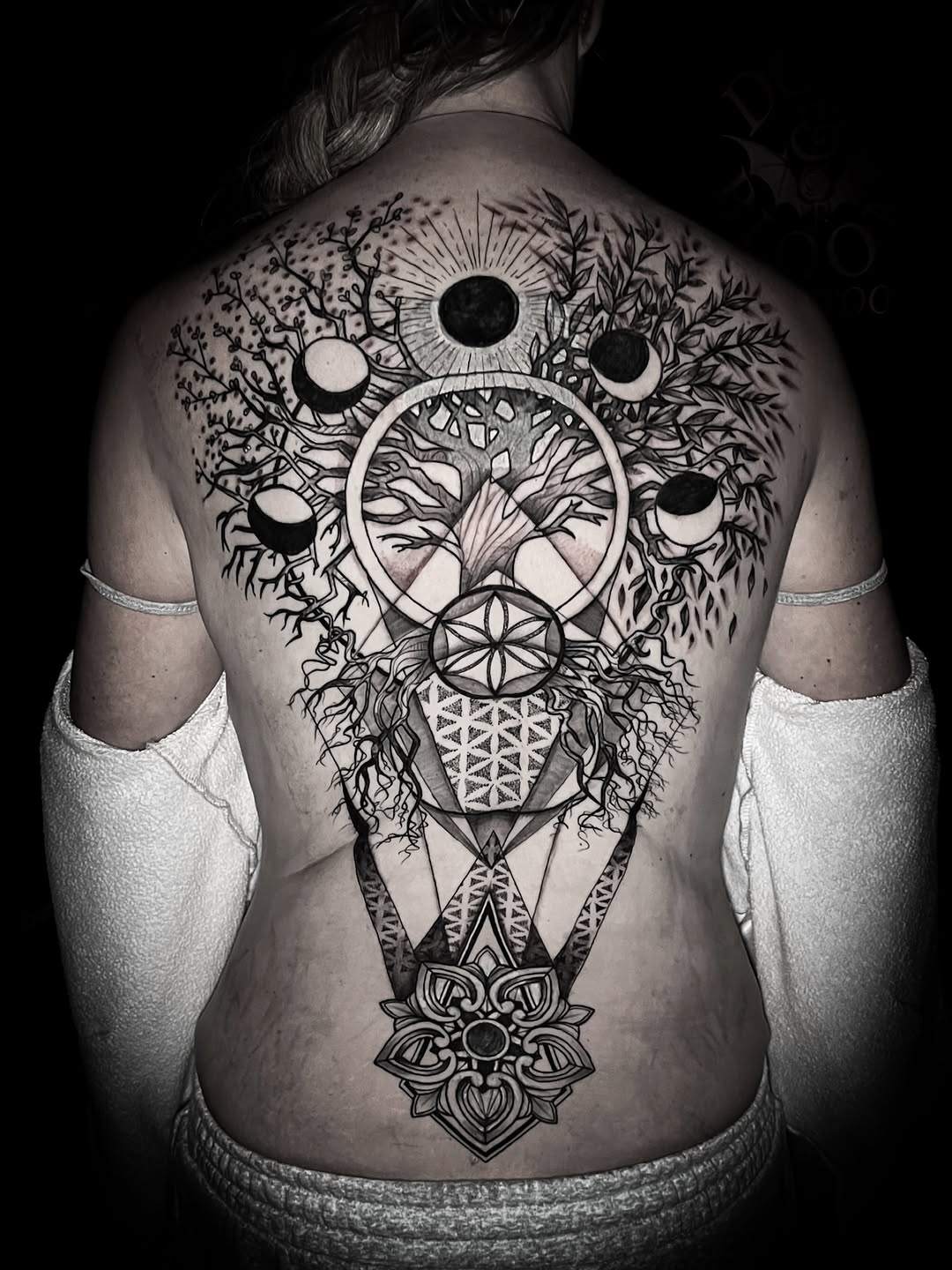 Geometric tattoo on the back by Lindsay Fernandez, Colorado Springs, Colorado