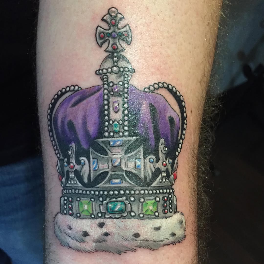 Crown with fur trim tattoo on the forearm by Bryan Hunt