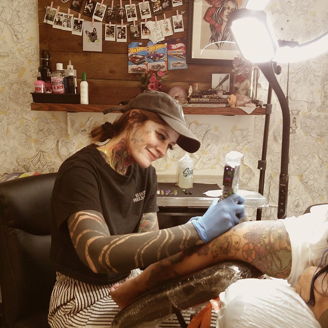 Floral design new school tattoo on the thigh by Rennie Tattoo