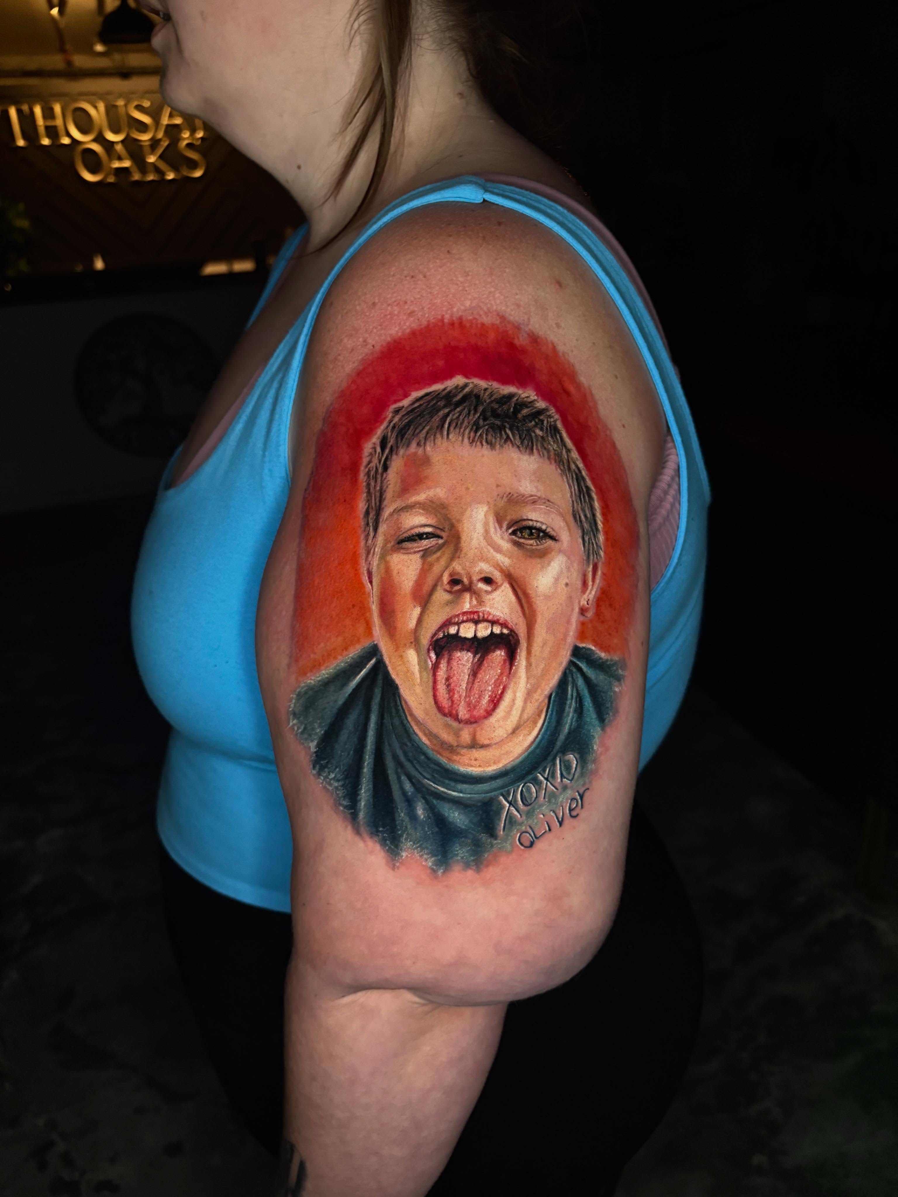 Portrait of a boy neo-traditional tattoo on the shoulder by Jacee Hamilton