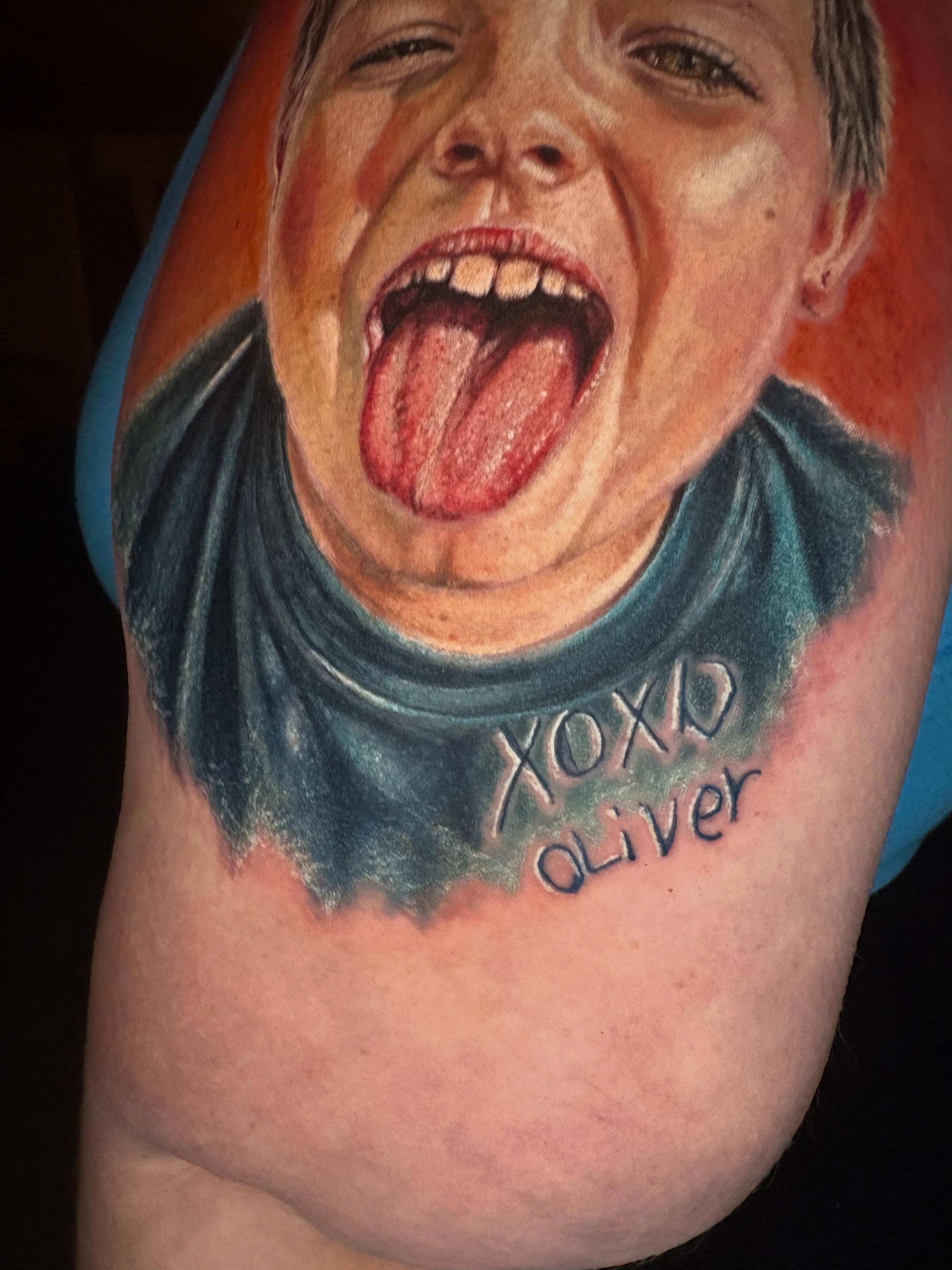 Child portrait with name tattoo on the shoulder by Jacee Hamilton