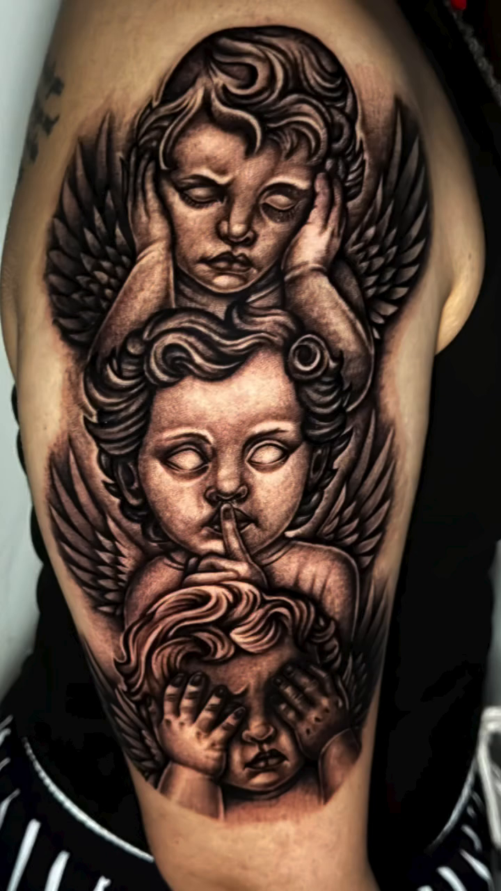 Cherub and cherub dark realism tattoo by professional tattoo artist