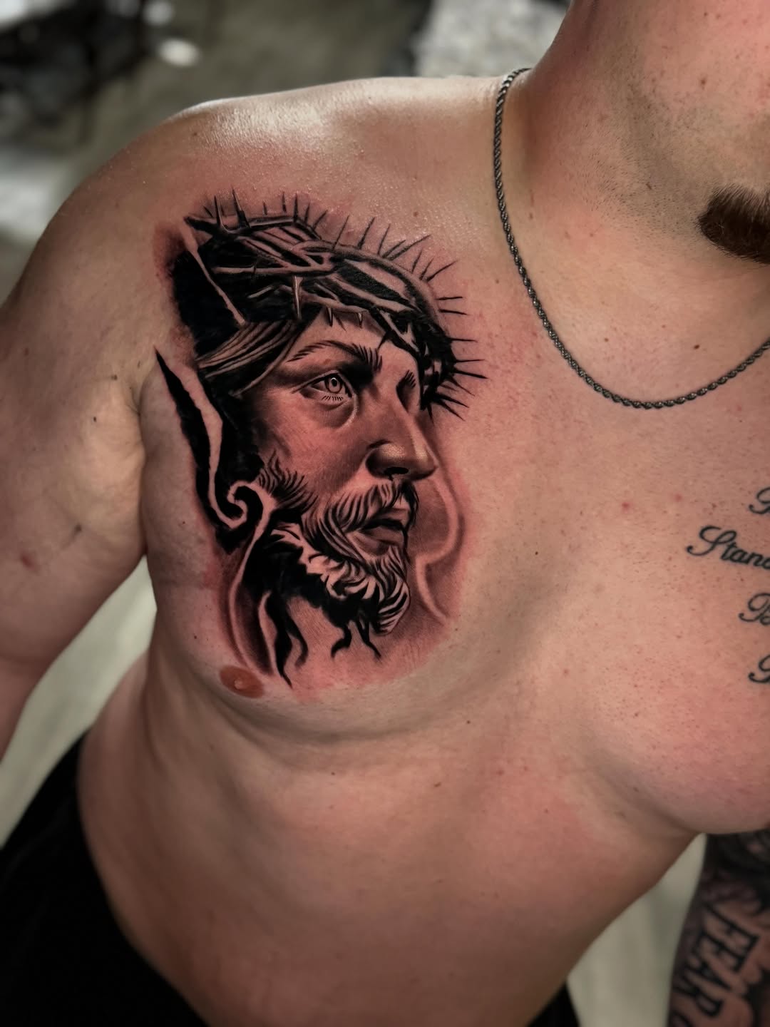 Jesus Christ portrait realism tattoo on the chest by Adrián Banuelos