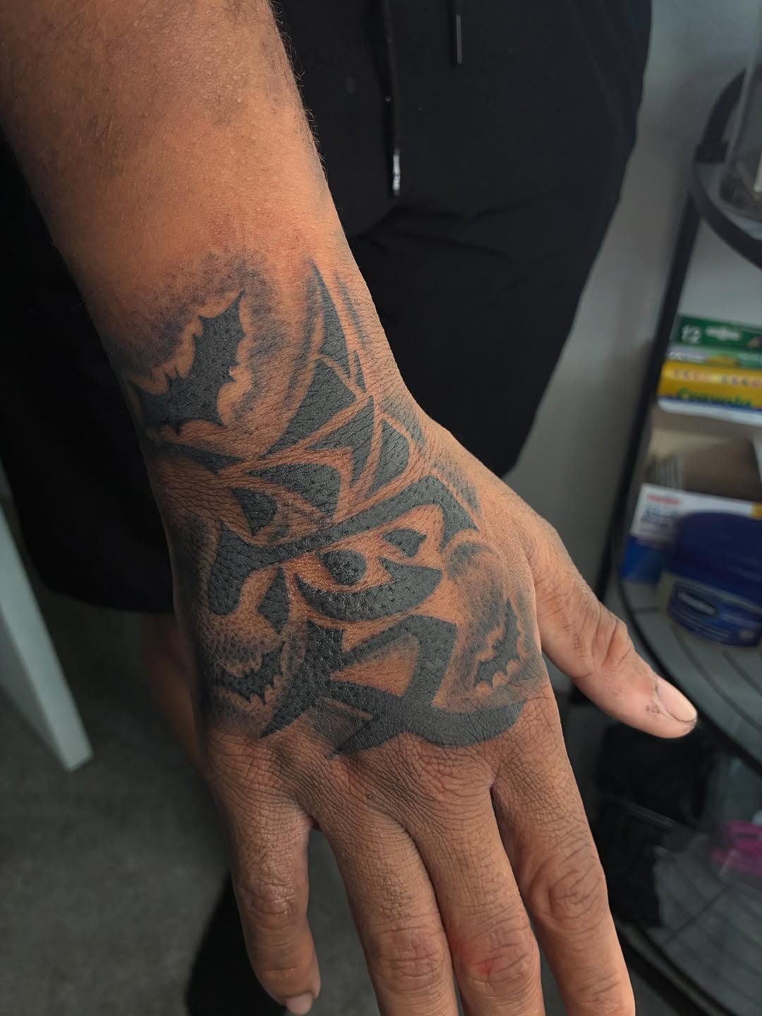 Tribal design with skulls blackwork tattoo on the hand by ɪɪɴᴋᴇᴅʙʏʀᴇɴɴ🐉