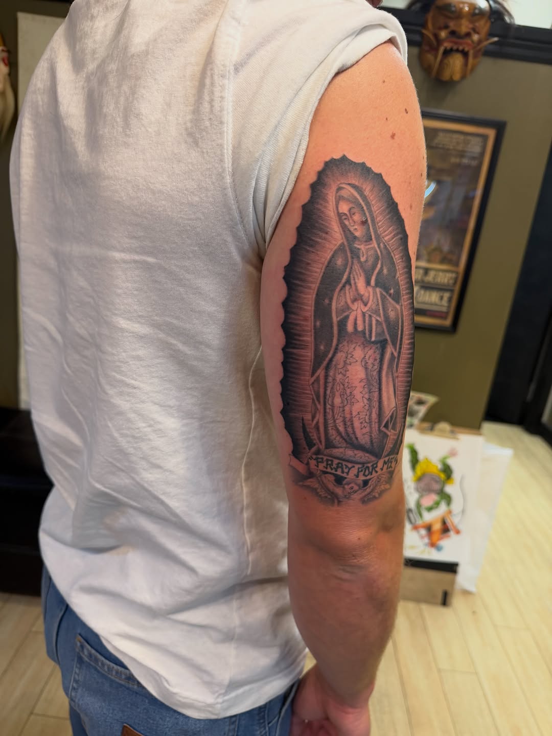 Virgin Mary with praying hands Chicano tattoo on the forearm by Winston Thai