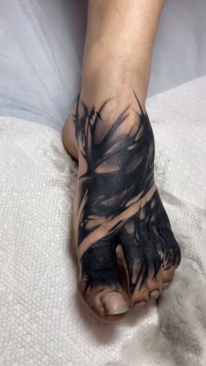 Abstract blackwork foot tattoo blackwork tattoo on the foot by Ramsie Segura-Andrews