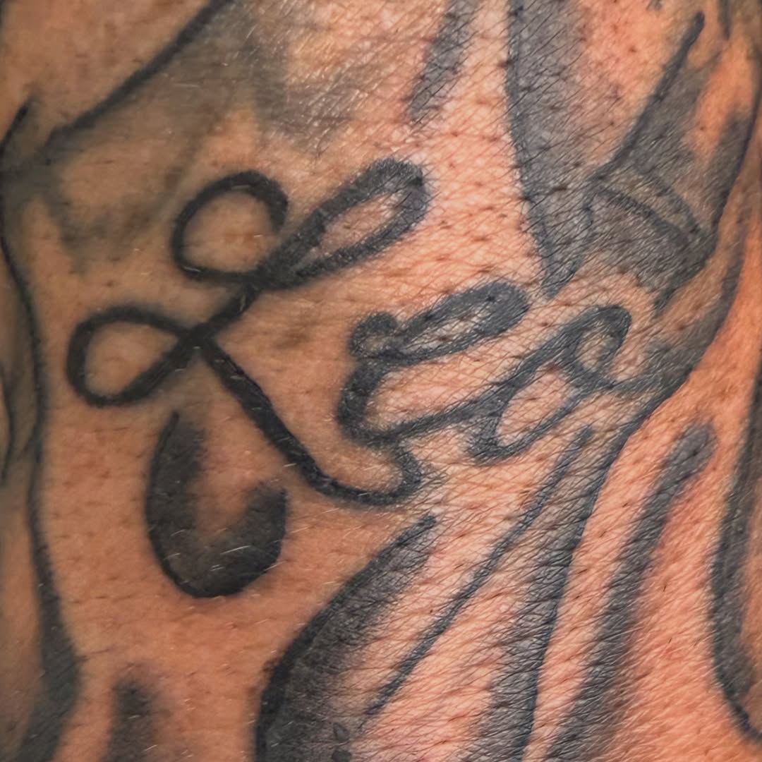 Script lettering tattoo on the forearm by Addison Bruce