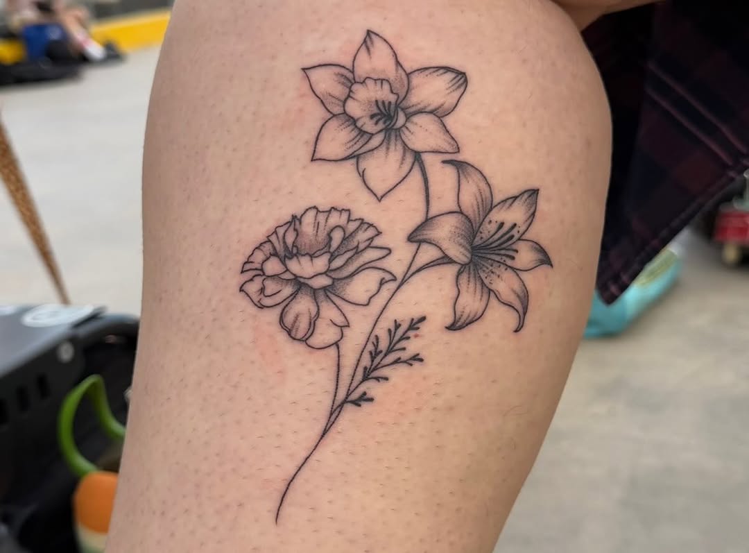 Three flowers fine line tattoo on the thigh by LooSid