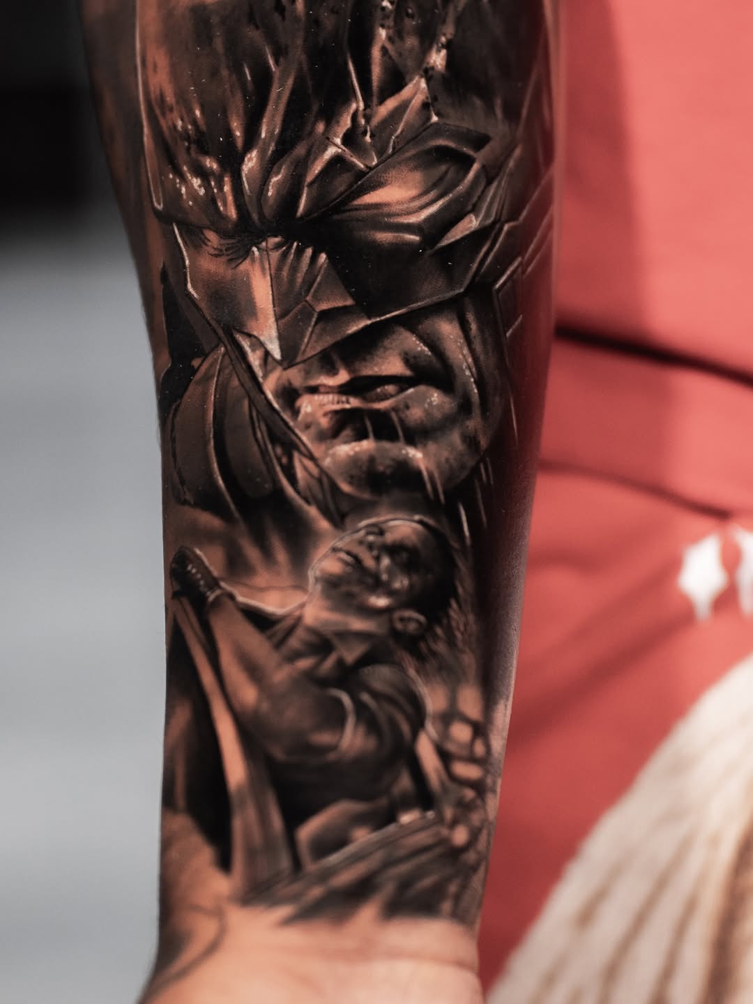 Batman and Joker realism tattoo on the forearm by Andres Pabon Tattoo Artist