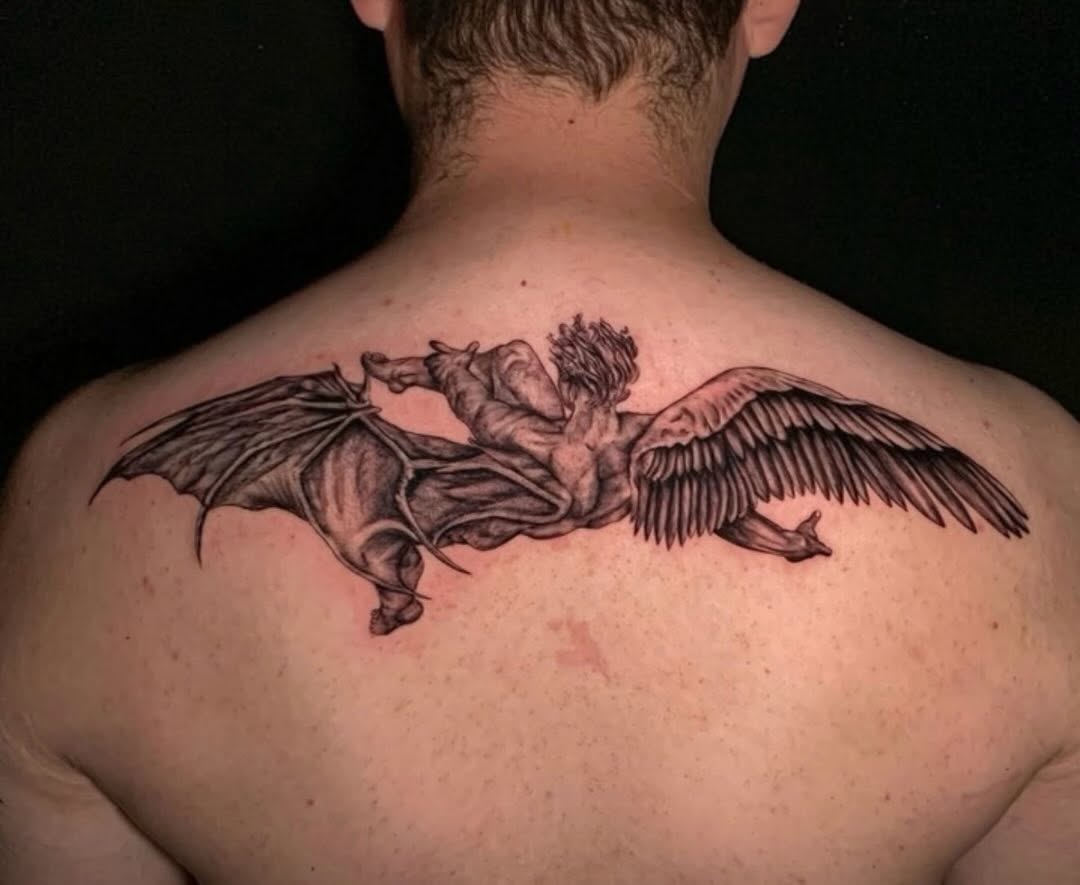Fallen angel realism tattoo on the back by @elijahtats