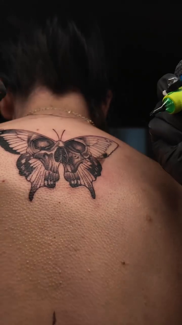 Butterfly tattoo on back fine line tattoo on the back by Tattoo Artist Vanessa