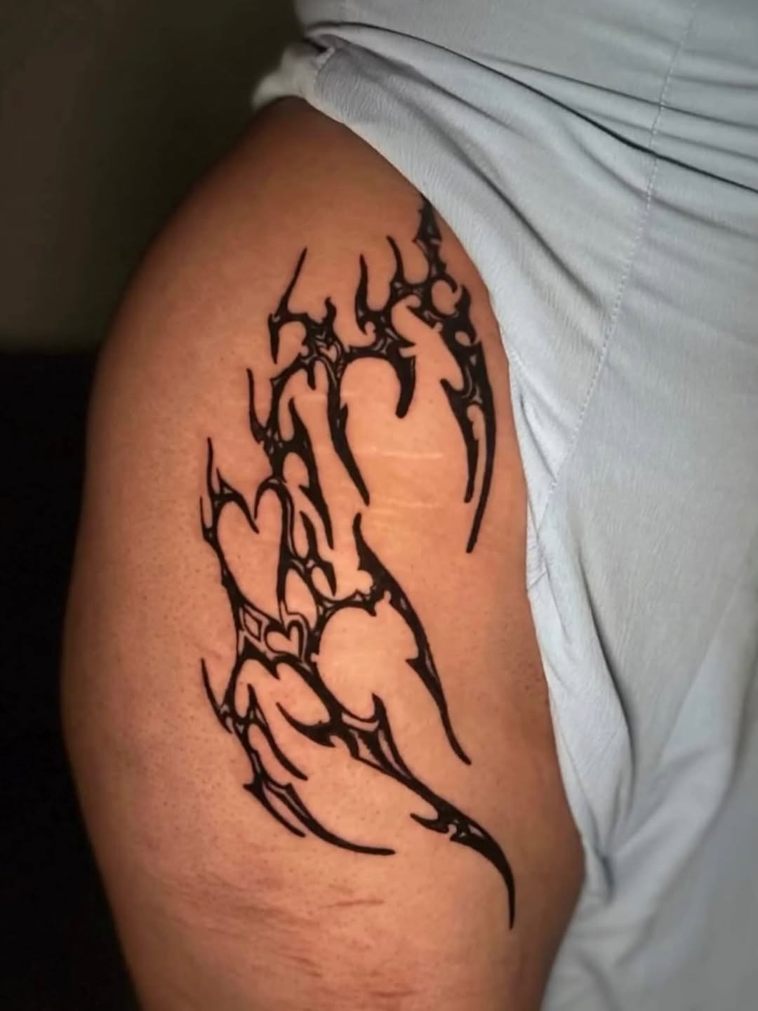 Abstract tribal design cyber sigilism tattoo on the thigh by @elijahtats