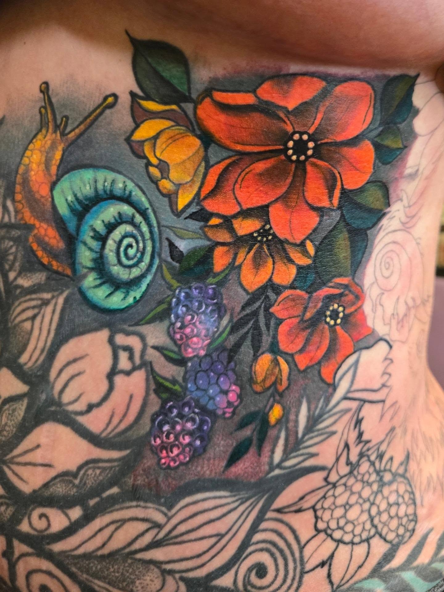 Flowers and snail American traditional tattoo on the chest by Irma π€β¨, Las Vegas, Nevada