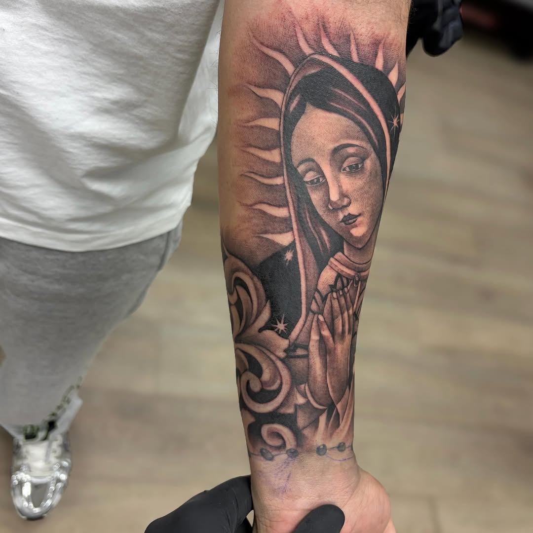 Religious figure realism tattoo on the forearm by Dallas Tattoo Artist