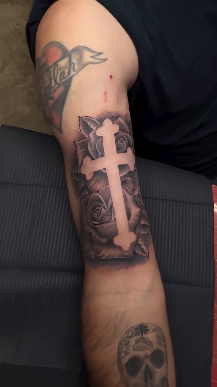 Cross with roses lettering tattoo on the forearm by Ricky Sanchez, Duncanville, Texas