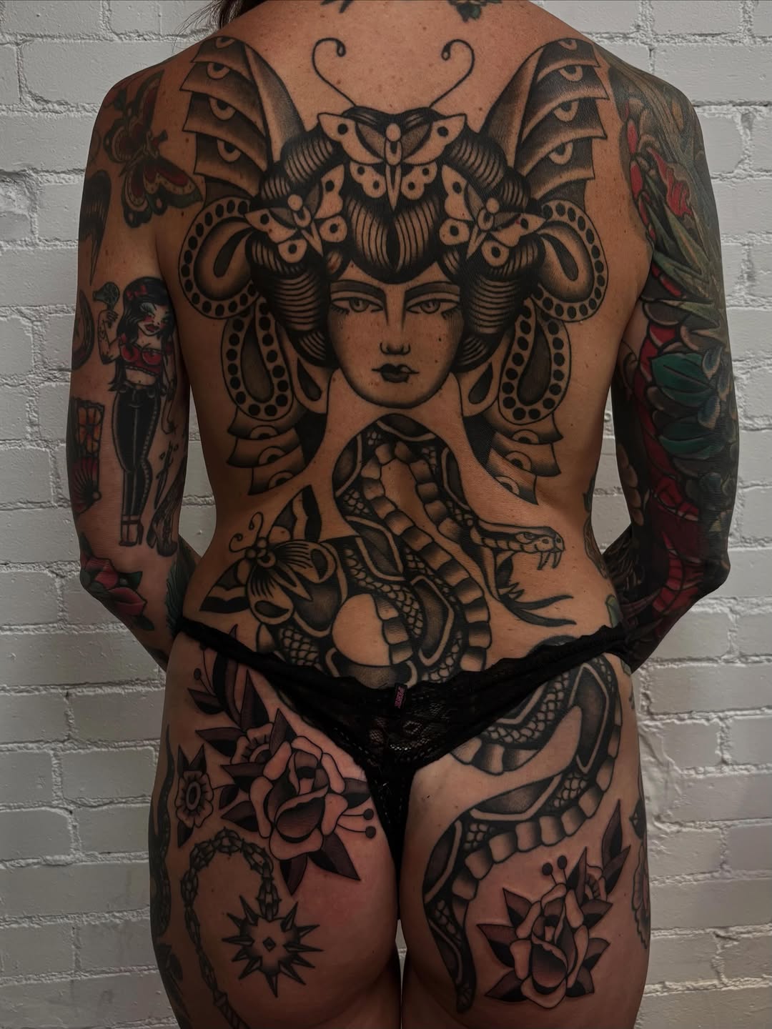 Medusa and snake tribal tattoo on the back by Claire Anderson