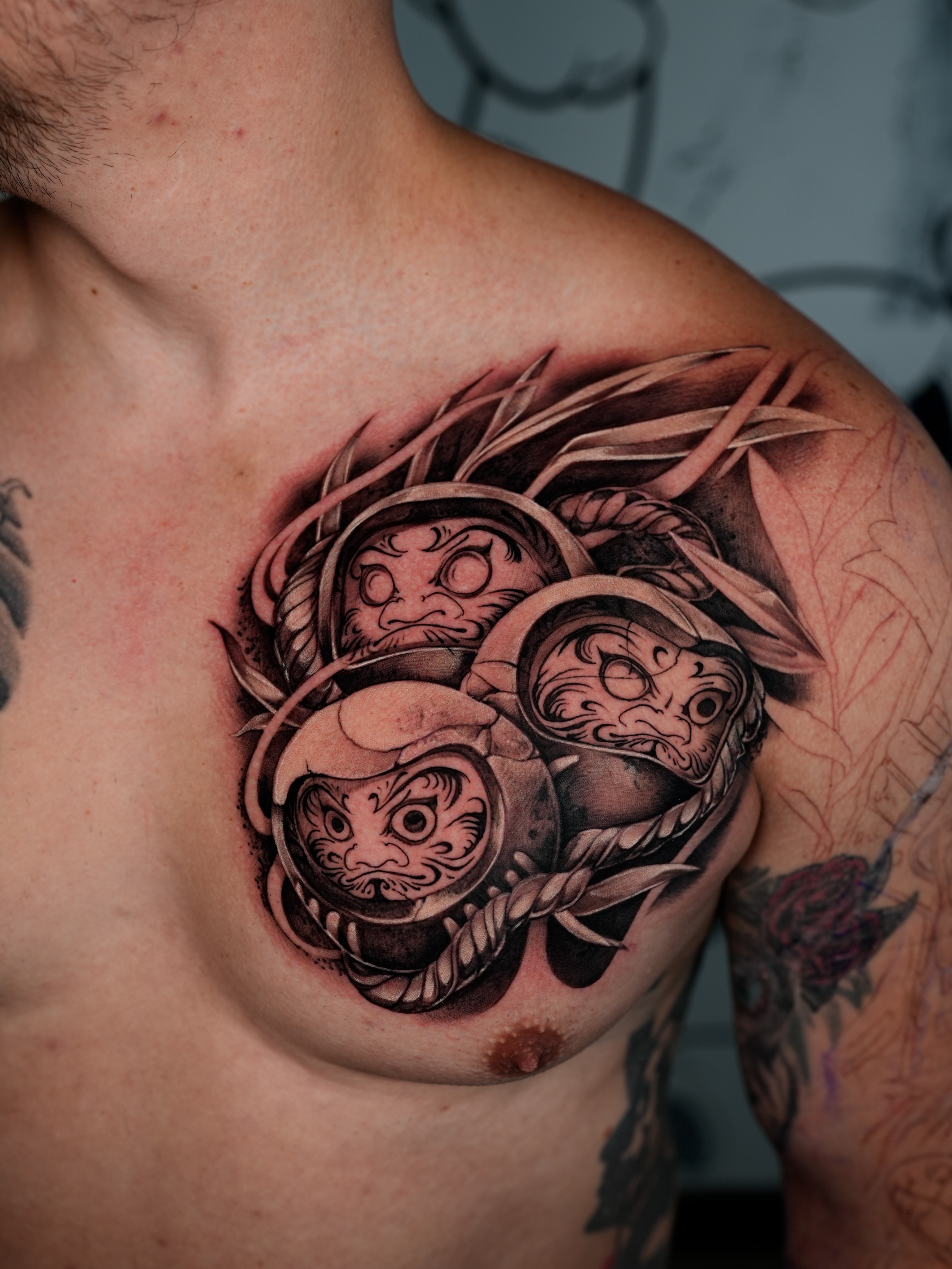 Mask black and grey tattoo on the chest by Ink Warden  Tattoo