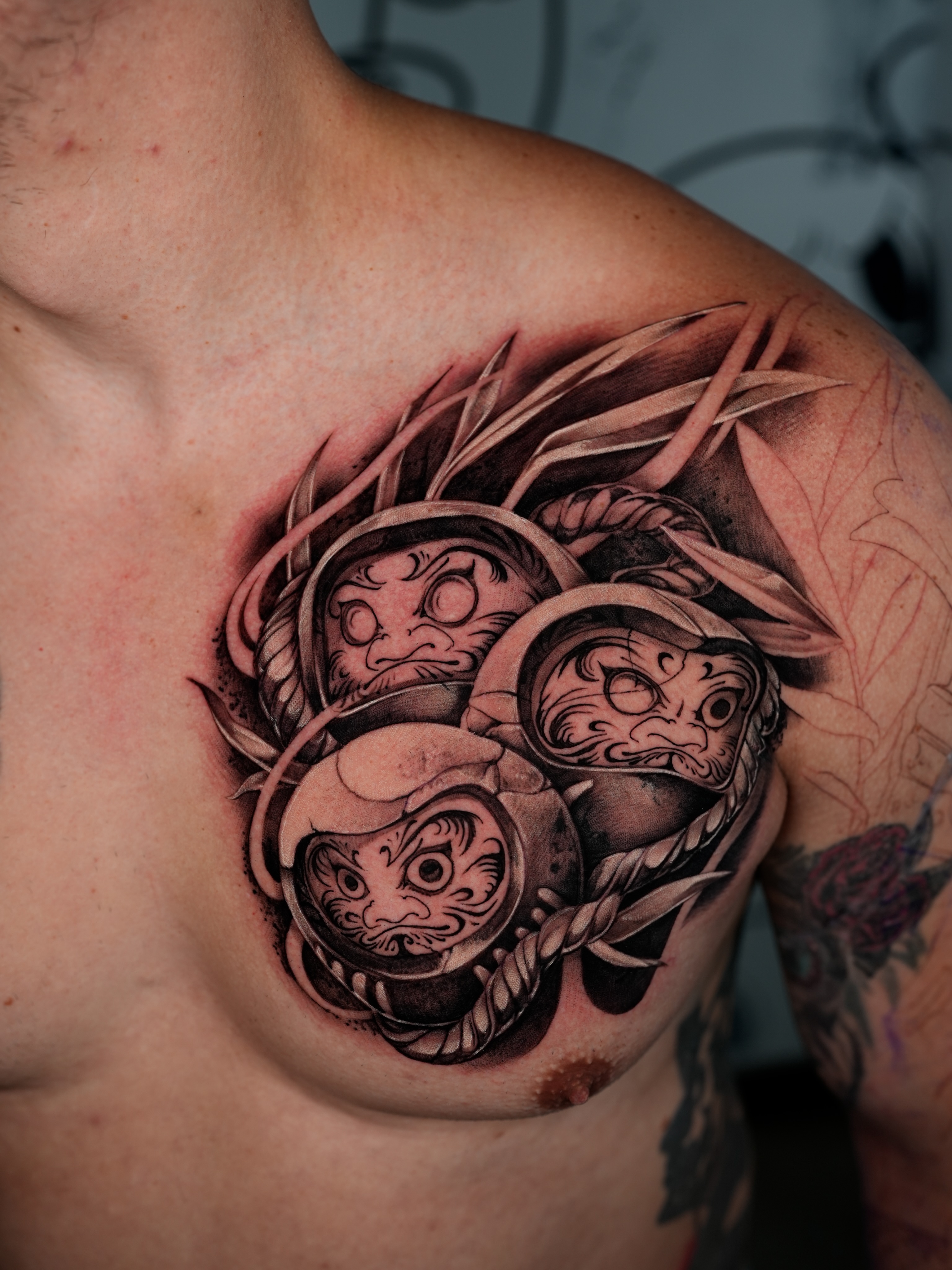 Mask black and grey tattoo on the chest by Ink Warden  Tattoo